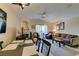 Spacious condo living room with dining area, fireplace, balcony, and comfortable seating at 5415 W Harmon Ave # 2075, Las Vegas, NV 89103