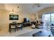This living area has an open layout, light tile flooring, and a cozy fireplace at 5415 W Harmon Ave # 2075, Las Vegas, NV 89103
