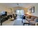 Inviting living room featuring a cozy fireplace, balcony access, and comfortable seating at 5415 W Harmon Ave # 2075, Las Vegas, NV 89103