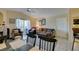 Well-lit living room with tile floors, a fireplace, balcony access, and neutral decor at 5415 W Harmon Ave # 2075, Las Vegas, NV 89103