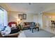 Bright living room with a comfortable sofa, a cozy recliner, and ample natural light streaming in at 5415 W Harmon Ave # 2075, Las Vegas, NV 89103