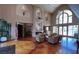 Community lobby featuring a fireplace, sitting area, tall ceilings and large windows at 5415 W Harmon Ave # 2075, Las Vegas, NV 89103