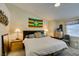 Main bedroom with a ceiling fan, large bed, and two nightstands at 5415 W Harmon Ave # 2075, Las Vegas, NV 89103