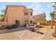 Large backyard featuring brick patio and gravel, enclosed by a brick wall, enhanced with string lights at 5917 Horsehair Blanket Dr, North Las Vegas, NV 89081