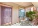 Welcoming front porch with seating area and lush greenery, perfect for relaxing outdoors at 5917 Horsehair Blanket Dr, North Las Vegas, NV 89081
