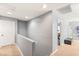 Hallway featuring a gray accent wall and carpet floors at 5917 Horsehair Blanket Dr, North Las Vegas, NV 89081