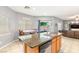 Kitchen featuring an island with granite countertops and stainless steel sink at 5917 Horsehair Blanket Dr, North Las Vegas, NV 89081