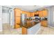 Bright kitchen with wood cabinets, granite countertops, and stainless steel appliances at 5917 Horsehair Blanket Dr, North Las Vegas, NV 89081