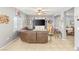 Open-concept living room with tiled flooring, providing a comfortable and airy space at 5917 Horsehair Blanket Dr, North Las Vegas, NV 89081