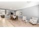 Bright living room featuring plush seating, neutral tones, and an adjacent dining space at 5917 Horsehair Blanket Dr, North Las Vegas, NV 89081