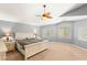 Spacious main bedroom with carpet floors and ceiling fan at 5917 Horsehair Blanket Dr, North Las Vegas, NV 89081