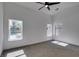 Spacious bedroom featuring ample natural light, ceiling fan, and views of the pool at 6126 Bedrock Ct, North Las Vegas, NV 89031
