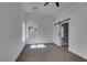 Bright bedroom featuring vaulted ceilings, a barn door, and neutral carpeting at 6126 Bedrock Ct, North Las Vegas, NV 89031