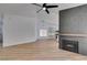 Living room shows wood floors and fireplace, open to the bright kitchen with island at 6126 Bedrock Ct, North Las Vegas, NV 89031