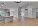 Open floorplan: the kitchen area leads into the living room and fireplace at 6126 Bedrock Ct, North Las Vegas, NV 89031