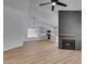 Open-concept living space with updated kitchen, modern fireplace, and bright, neutral decor at 6126 Bedrock Ct, North Las Vegas, NV 89031