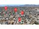 Wide aerial shot displaying community streets, a local church, and mountain views at 6628 Celeste Ave, Las Vegas, NV 89107