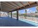 The covered balcony overlooks the neighborhood, with views of a pool and palm trees at 6628 Celeste Ave, Las Vegas, NV 89107