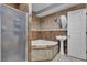 The bathroom features a corner tub, tiled walls, and a pedestal sink at 6628 Celeste Ave, Las Vegas, NV 89107