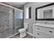 Contemporary bathroom with glass-enclosed shower, gray tile and modern vanity at 6628 Celeste Ave, Las Vegas, NV 89107
