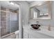 Bathroom with a vessel sink, a large mirror, and a glass enclosed tiled shower at 6628 Celeste Ave, Las Vegas, NV 89107