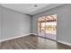 This bedroom has wood floors and a sliding glass door for access to an outdoor balcony at 6628 Celeste Ave, Las Vegas, NV 89107