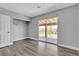 Bedroom with wood floors, a sliding glass door to the balcony, and a closet at 6628 Celeste Ave, Las Vegas, NV 89107
