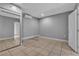 This bedroom includes tiled floors, a mirrored closet, and neutral paint at 6628 Celeste Ave, Las Vegas, NV 89107