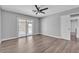 Spacious bedroom features new wood floors, a ceiling fan, and access to an outdoor balcony at 6628 Celeste Ave, Las Vegas, NV 89107