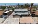 Two-story home showcasing a gray roof, a two-car garage, rock landscaping, and desert landscaping at 6628 Celeste Ave, Las Vegas, NV 89107