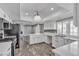 Modern kitchen featuring white cabinets, stainless steel appliances, and a breakfast bar at 6628 Celeste Ave, Las Vegas, NV 89107