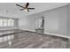 Spacious living room with marble floors, neutral walls, and modern ceiling fan at 6628 Celeste Ave, Las Vegas, NV 89107