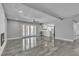 Bright living room with fireplace, double doors and views of the kitchen with a large countertop at 6628 Celeste Ave, Las Vegas, NV 89107