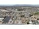 Aerial view of a residential community featuring roadways, neighborhood homes, and vast desert landscape at 6628 Celeste Ave, Las Vegas, NV 89107