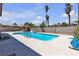 Relaxing pool with patio furniture, lush landscaping, and barbecue at 6628 Celeste Ave, Las Vegas, NV 89107