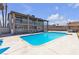 Sparkling pool with deck, lush landscaping and two-story building at 6628 Celeste Ave, Las Vegas, NV 89107