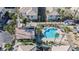 Aerial view showcasing community pools, lush landscaping, and well-maintained apartment buildings with ample parking at 6808 Indian Chief Dr # 204, Las Vegas, NV 89130