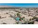 Aerial view of apartment complex featuring a sparkling pool and well-maintained landscaping on a sunny day at 6808 Indian Chief Dr # 204, Las Vegas, NV 89130