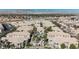 Aerial view of the complex highlighting architecture and landscaping, complemented by lush trees at 6808 Indian Chief Dr # 204, Las Vegas, NV 89130