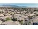 Aerial view of a condo neighborhood featuring a pool and desert landscape views at 6808 Indian Chief Dr # 204, Las Vegas, NV 89130