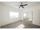 A bedroom with carpet, ceiling fan, and mirrored closet doors at 6808 Indian Chief Dr # 204, Las Vegas, NV 89130