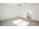 Spacious, carpeted bedroom features a ceiling fan, light walls, and ensuite bathroom access at 6808 Indian Chief Dr # 204, Las Vegas, NV 89130