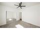 Carpeted bedroom with ceiling fan and an open door leading to another room at 6808 Indian Chief Dr # 204, Las Vegas, NV 89130