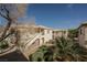 An exterior view of apartments showcasing private balconies at 6808 Indian Chief Dr # 204, Las Vegas, NV 89130