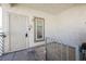 Apartment entrance featuring a secure metal door, window, and modern access controls at 6808 Indian Chief Dr # 204, Las Vegas, NV 89130