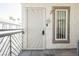 Apartment front door with security features, number 204, and a glimpse of palm trees at 6808 Indian Chief Dr # 204, Las Vegas, NV 89130