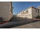 Exterior shot of garages with textured stucco, offering convenient parking for residents at 6808 Indian Chief Dr # 204, Las Vegas, NV 89130