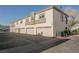 Exterior shot of garages with textured stucco, offering convenient parking for residents at 6808 Indian Chief Dr # 204, Las Vegas, NV 89130