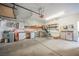 Well-lit garage with storage solutions, workbench area, and room for vehicles and hobbies at 6808 Indian Chief Dr # 204, Las Vegas, NV 89130