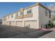 Exterior shot of garages with textured stucco, offering convenient parking for residents at 6808 Indian Chief Dr # 204, Las Vegas, NV 89130